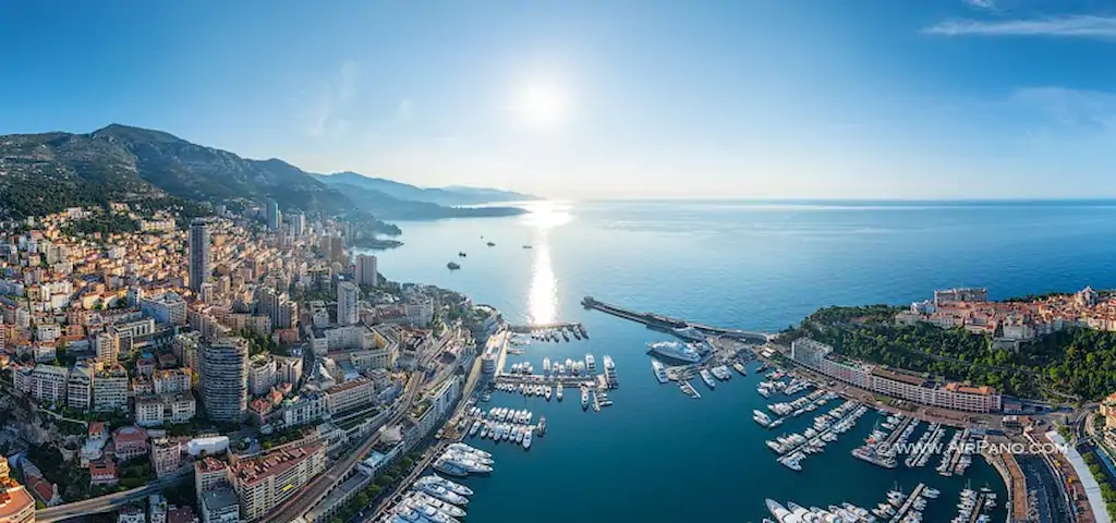 Panaromic image of Ariel view over French Riviera of Monaco. One can see beautiful port of Monaco with yachts parked around it.